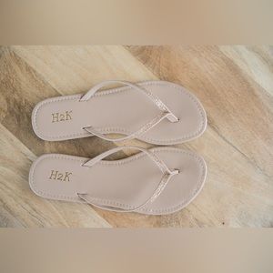Nude flip flops.